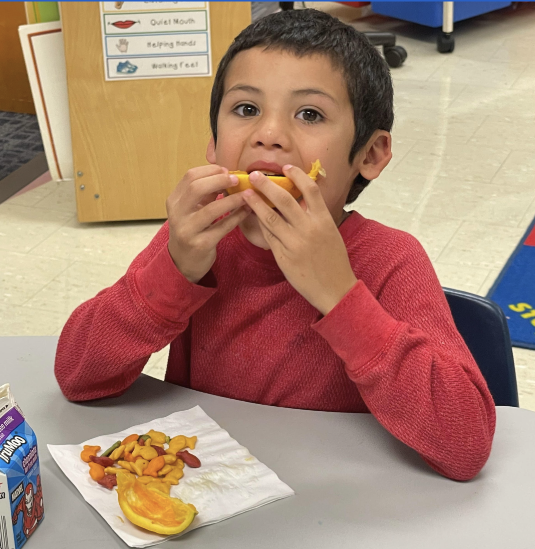 Kid eating fruit